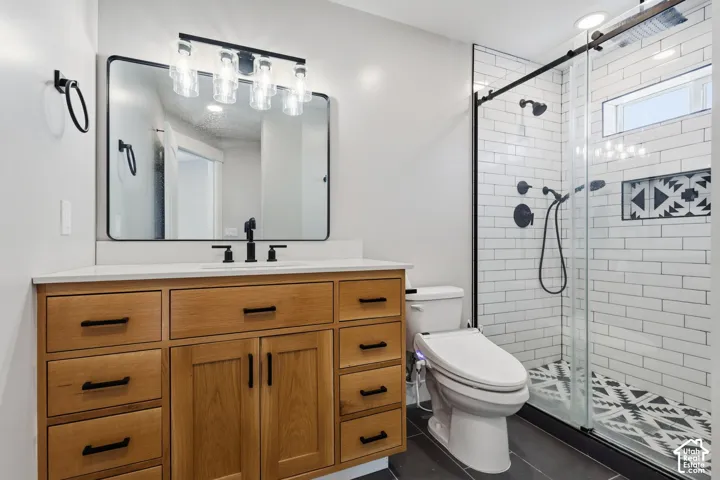 Double vanity with a white countertop and natural wood-tone cabinetry