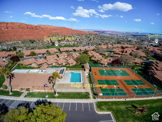 Community amenities including a swimming pool, multiple tennis courts, and a club house