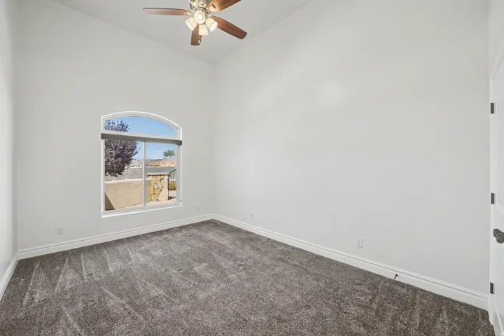 Vaulted ceiling with a ceiling fan