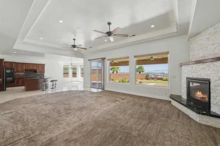 Recessed lighting in a tray ceiling with multiple ceiling fans