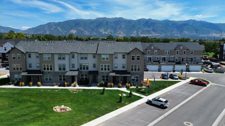 Modern townhome exteriors featuring varied siding and stone accents