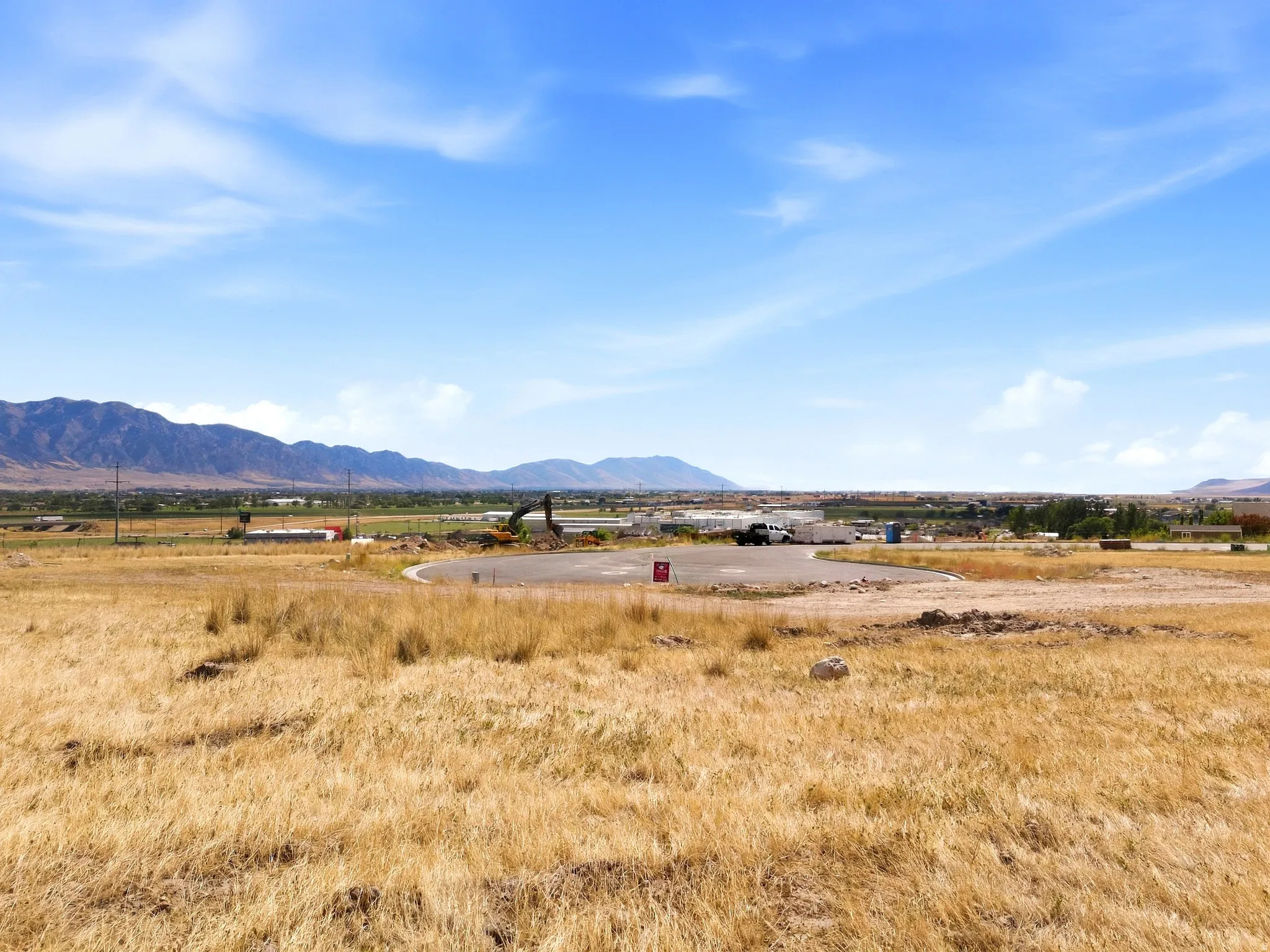 Expansive lot with mountain backdrop.