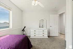 Recessed lighting, ceiling fan, window with blinds, paneled interior door, and wall trim