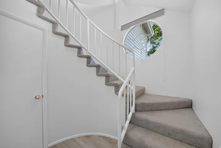 Entry way w/ storage closet.  Staircase leads to living areas of the condo.