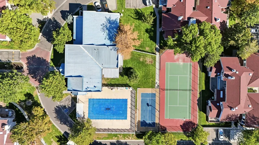 Community amenities featuring a tennis court, a basketball half-court, and a covered swimming pool
