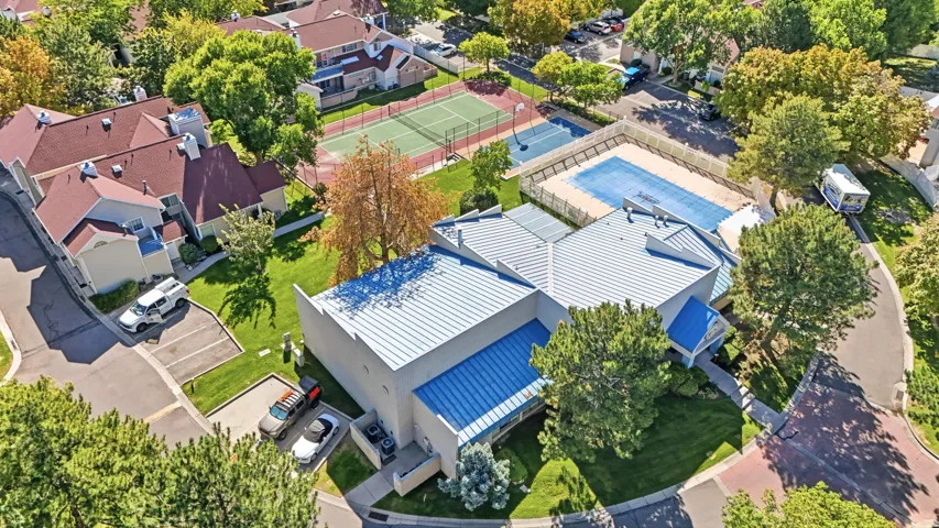 Community amenities featuring a tennis court, and second covered swimming pool.