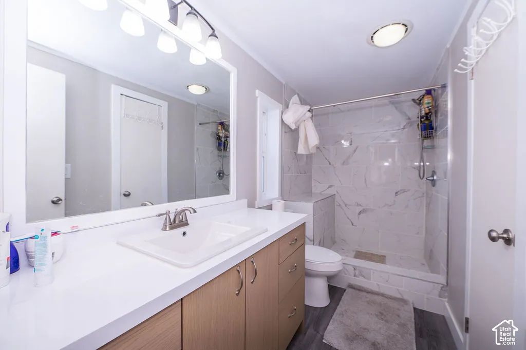 White countertop vanity with wood-finish cabinetry