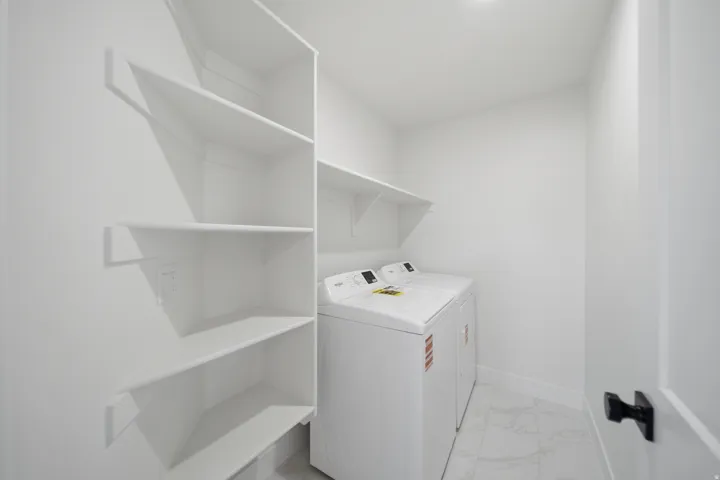 White stacked shelving, white wall-mounted shelving, and white tile flooring