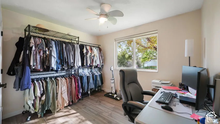 Recessed window, wood-finish flooring, and ceiling fan