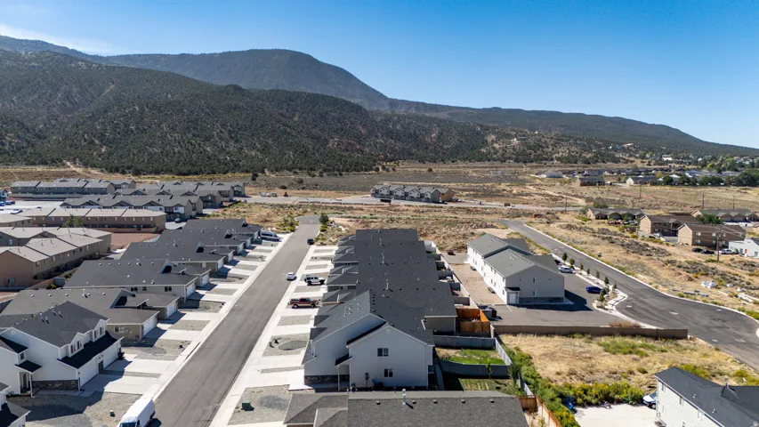 Newly constructed residential community with mountain backdrop