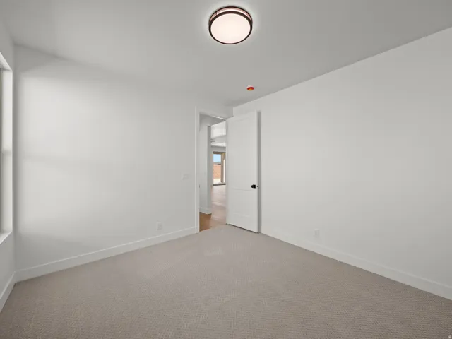 Neutral-toned carpeting paired with white walls