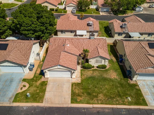 Single-story residence featuring a tile roof and attached two-car garage