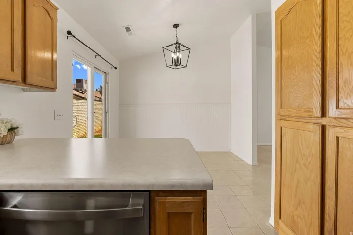 Kitchen island with a laminate countertop and integrated stainless steel appliance