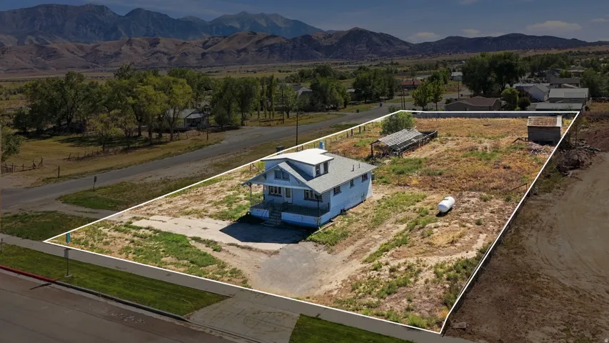 Single-family residence with a light-colored exterior and a multi-level roofline