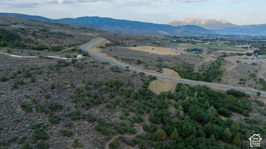 Mountain backdrop with a distant developed area