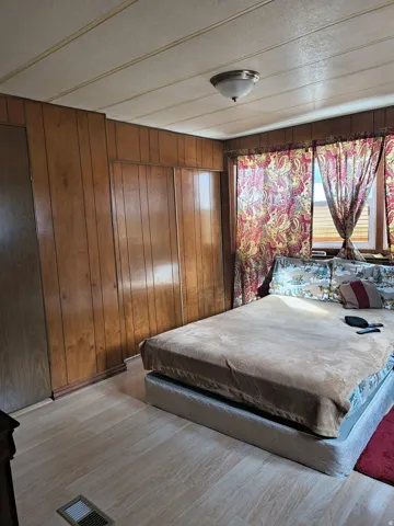 Wood-finish wall paneling with integrated storage