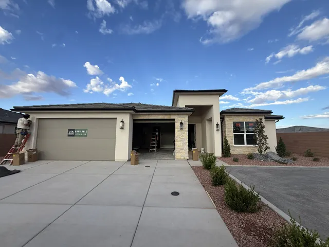 Contemporary exterior with stucco and stone accents