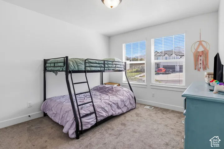 Wall-to-wall carpeting with white wall paint