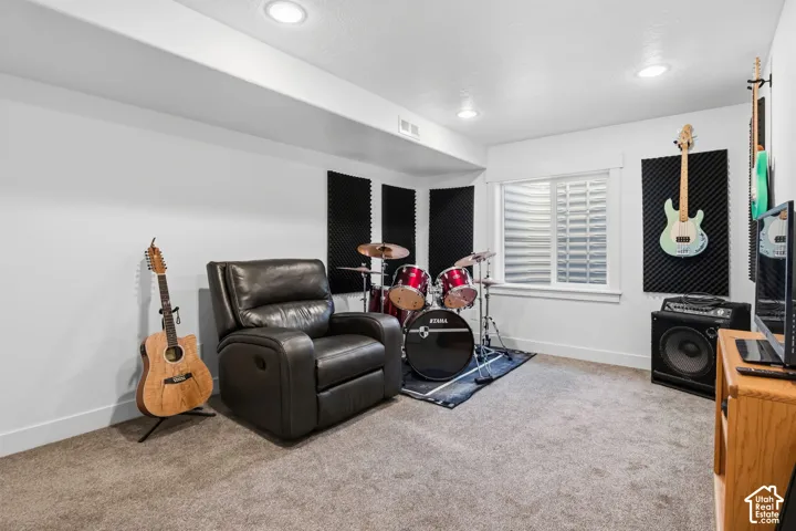 Recessed ceiling lighting, carpet flooring, single window, and white walls