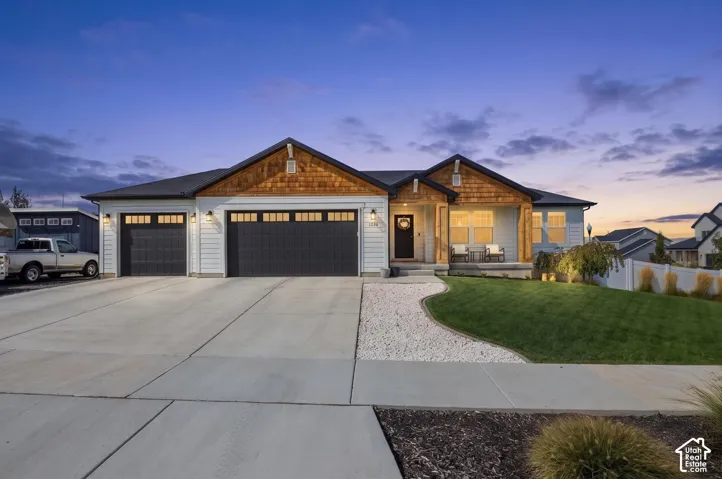 Craftsman-style exterior with shingle siding accents and a covered front porch