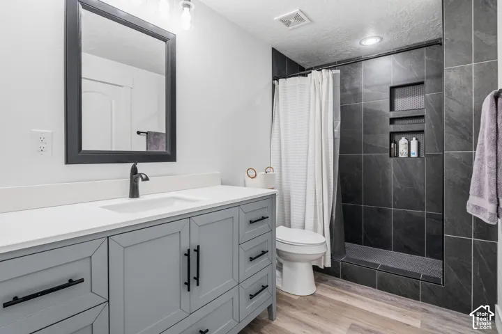 Floating vanity with a white countertop and integrated sink