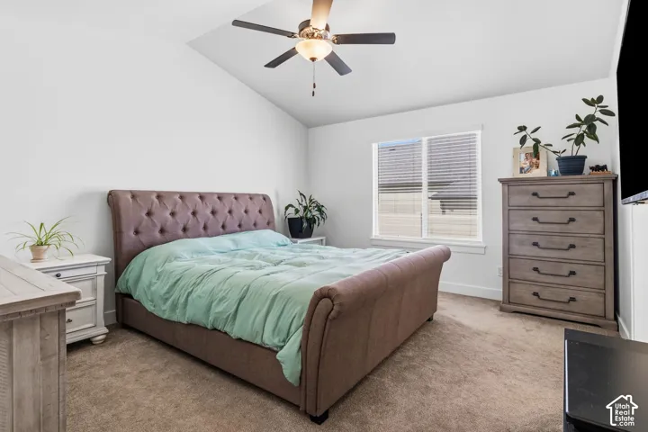 Vaulted ceilings complement the neutral carpet and white walls