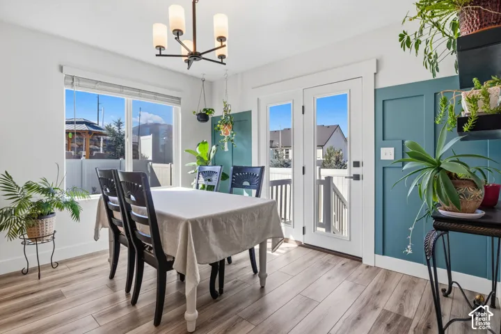 Wood-finish flooring, white walls, and a feature wall with board and batten detailing