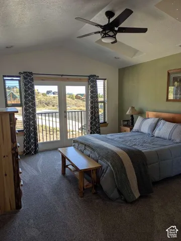 Vaulted ceiling with recessed lighting and ceiling fan