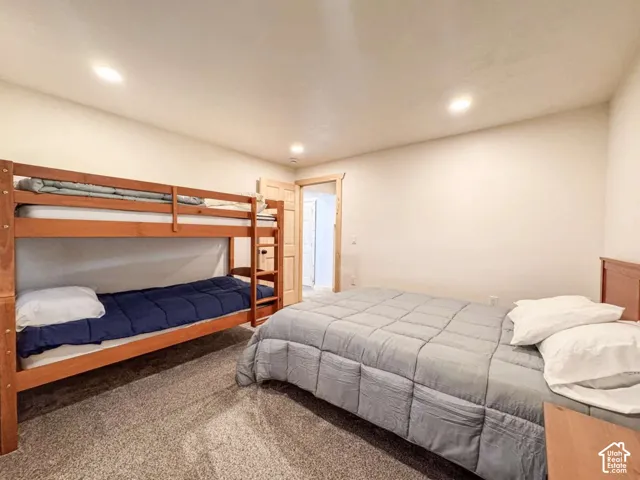 Neutral-toned walls complement plush carpeting