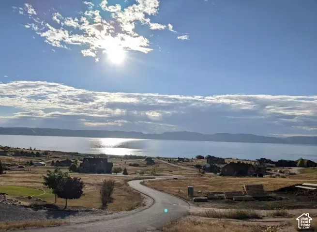 Expansive rural property offering sweeping vistas across open pastureland and water frontage