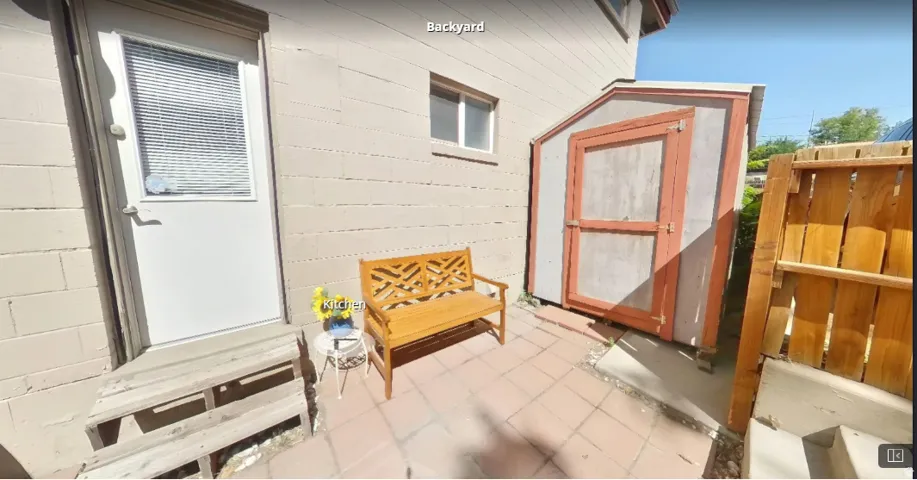 Large fenced backyard with private shed.