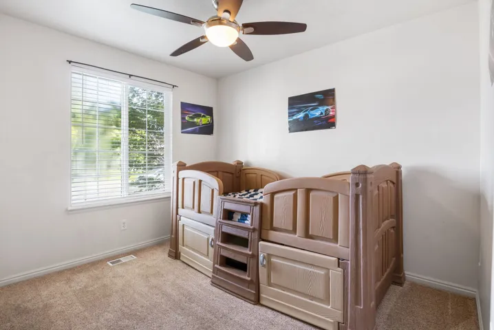 White walls complement the light-toned carpet