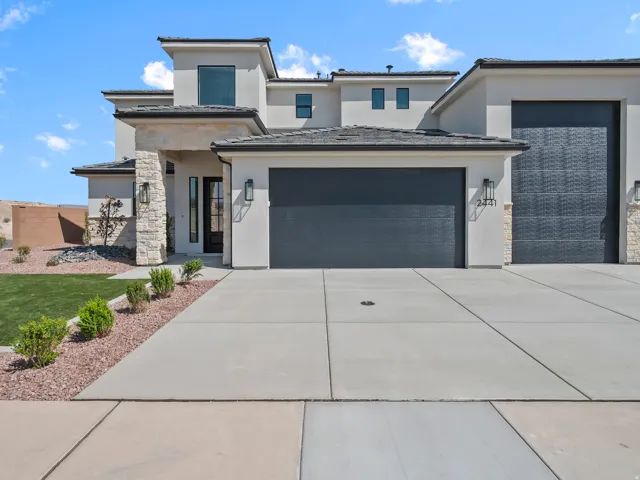 Contemporary exterior featuring stucco and stone accents