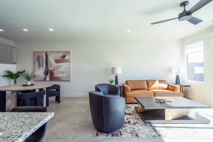 Recessed lighting, ceiling fan, and large windows provide ample illumination