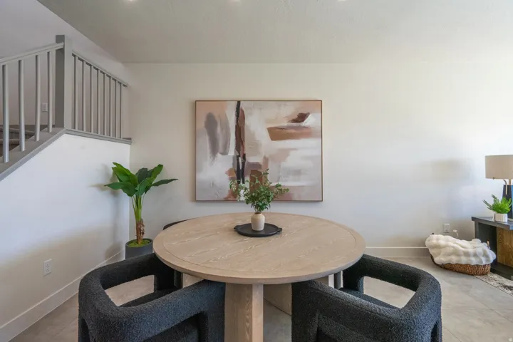 Neutral wall paint, recessed ceiling lights, and light wood-finish flooring