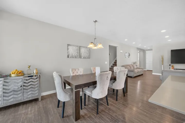 Wood-finish flooring throughout, complemented by recessed lighting