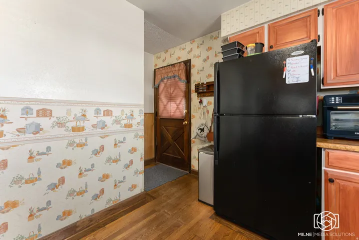 Wood-finish flooring with a contrasting wallpaper accent