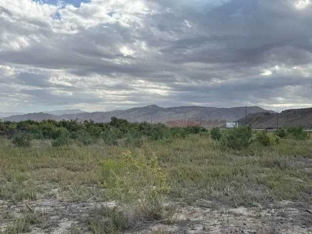 Expansive undeveloped land with a distant mountain backdrop
