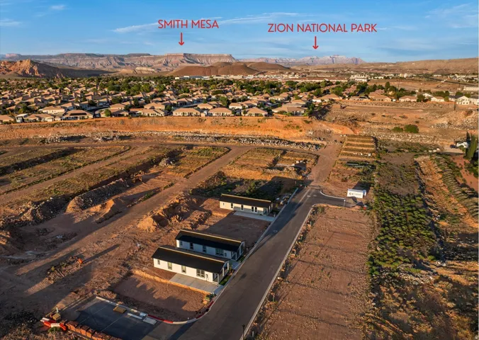 Developed land with newly paved streets and several new construction residences