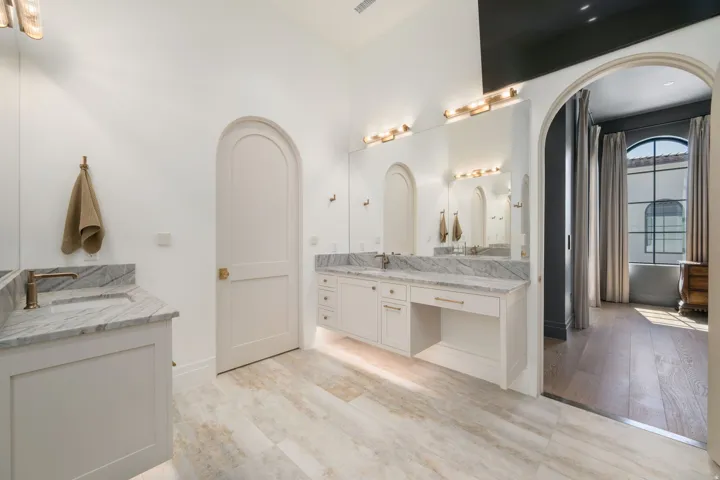 Dual vanity with stone countertops and undermount sinks