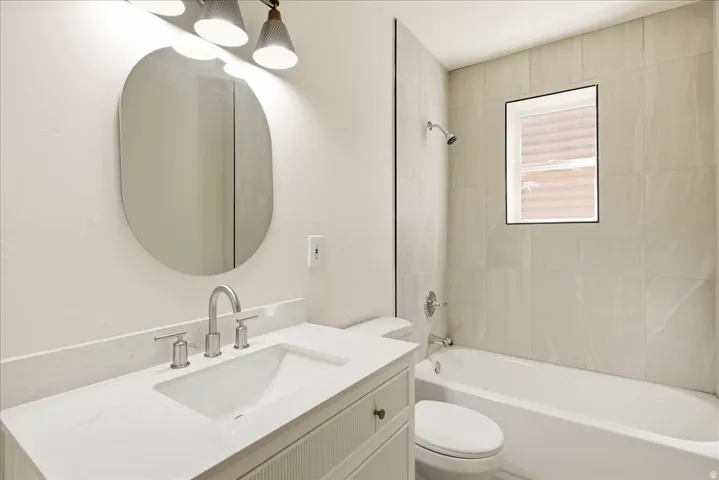 Contemporary vanity with a rectangular undermount sink and brushed nickel faucet
