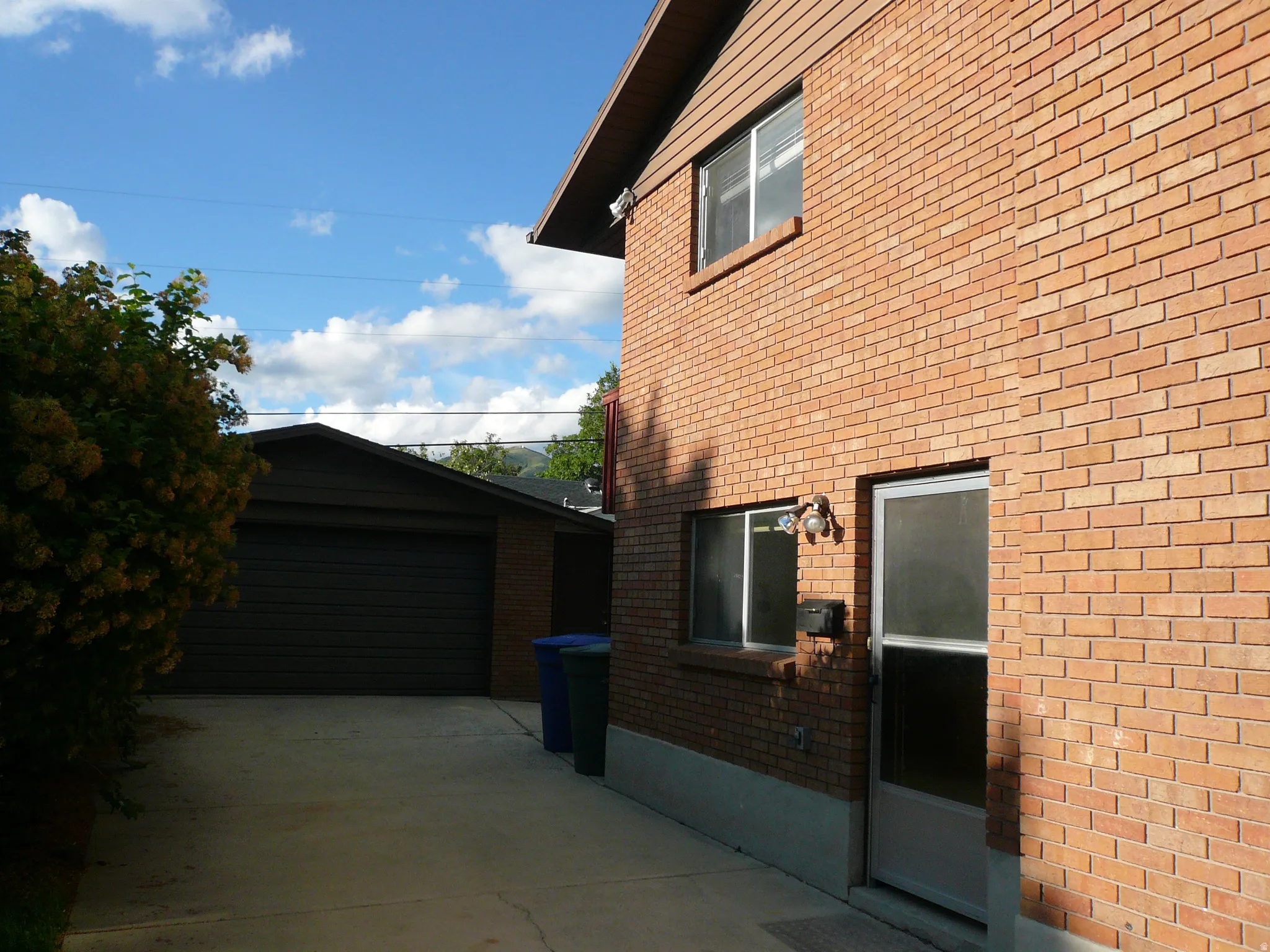 Brick exterior siding with an attached garage