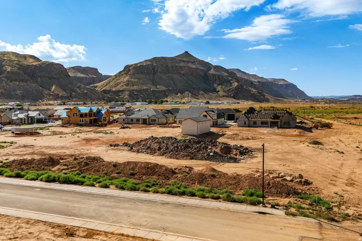 Residential development under construction with mountain backdrop