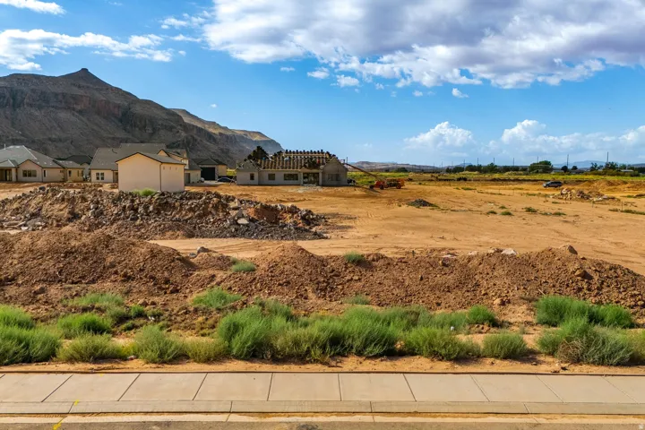 Expansive land parcel with surrounding mountain backdrop