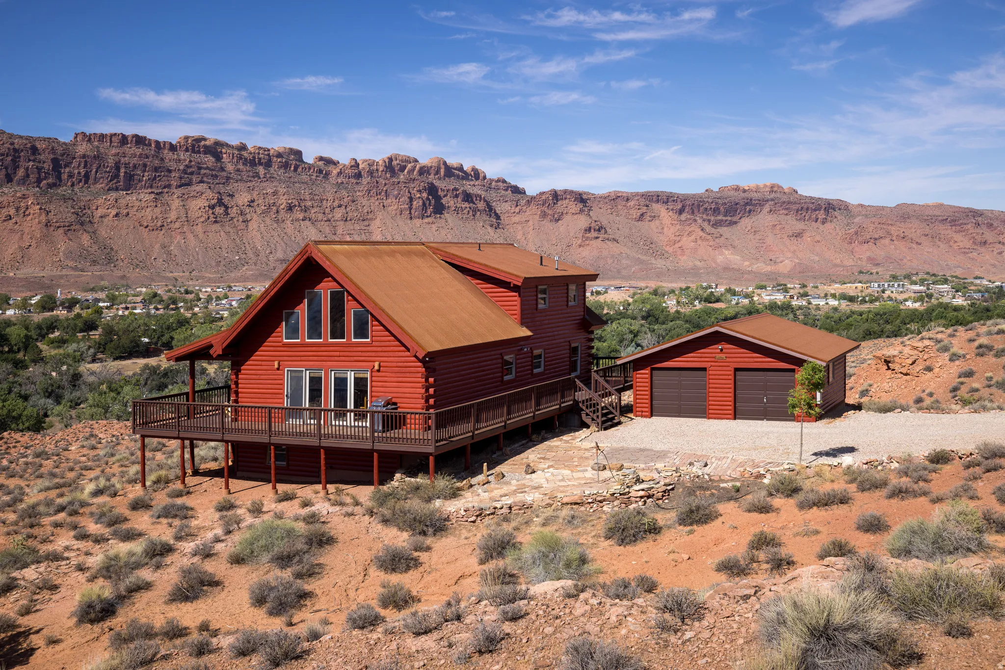 Red log-sided exterior with a natural-tone roof