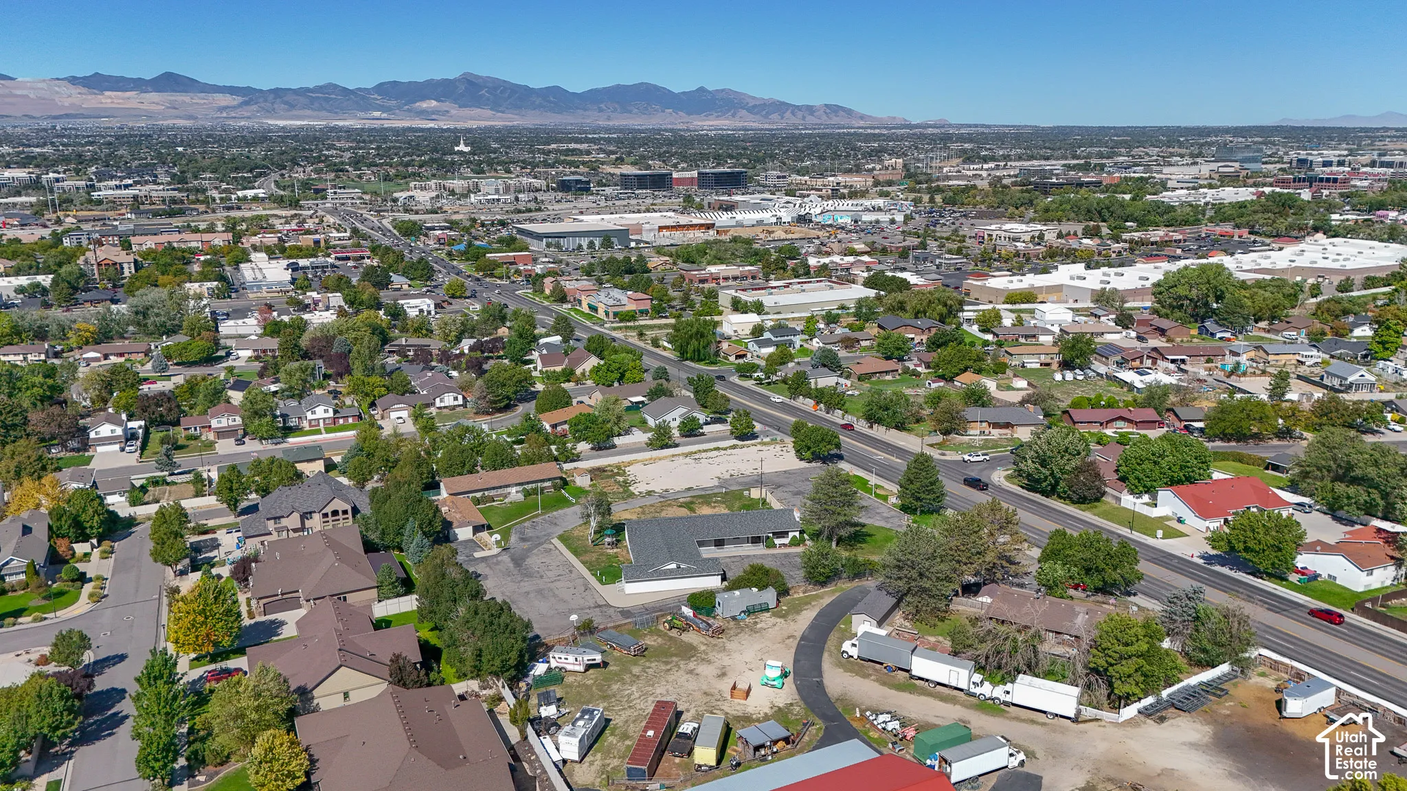 Aerial overview of a developed urban area with varied residential and commercial structures