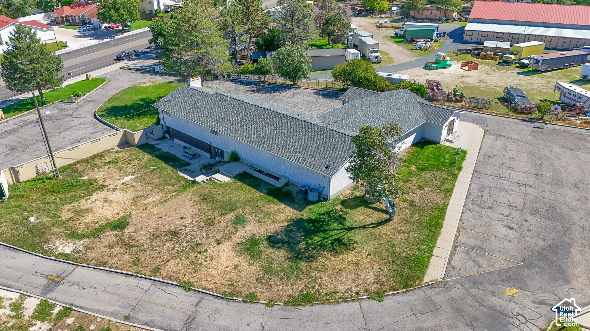 Single-story commercial building with an asphalt shingle roof