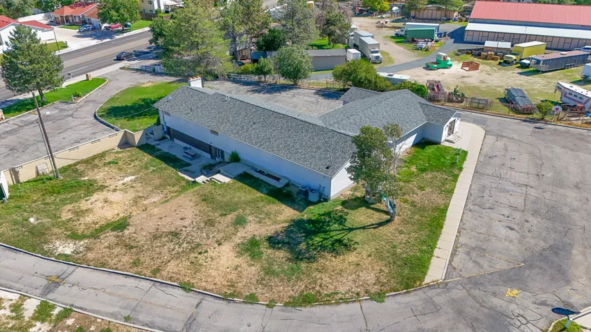 Single-story commercial building with an asphalt shingle roof