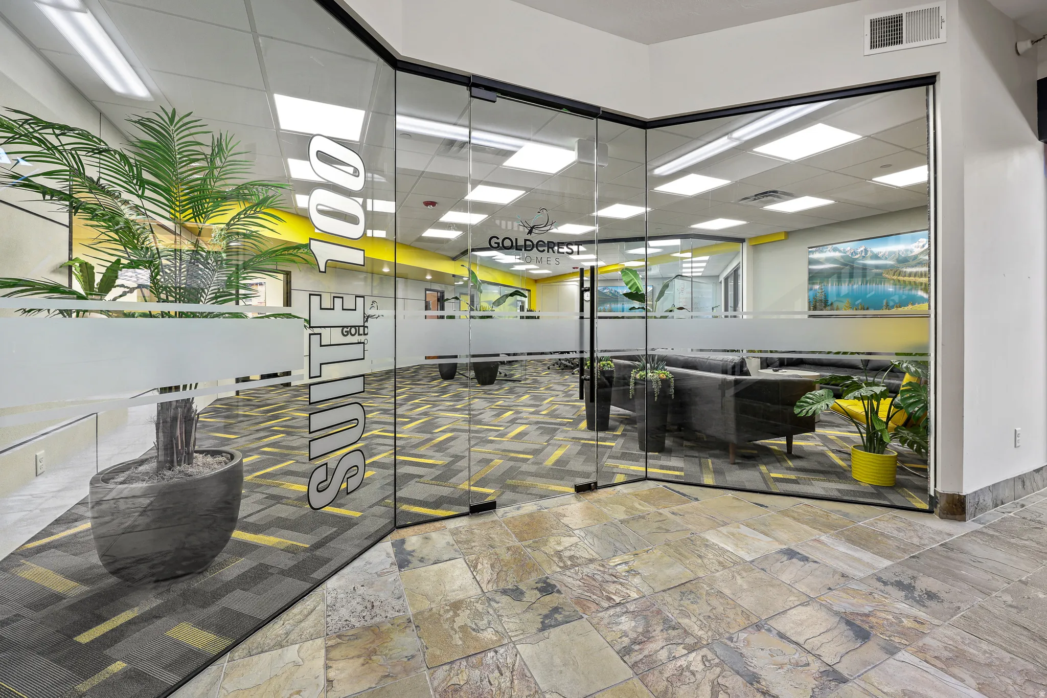 Glass wall with frosted elements, patterned flooring, and recessed ceiling lighting