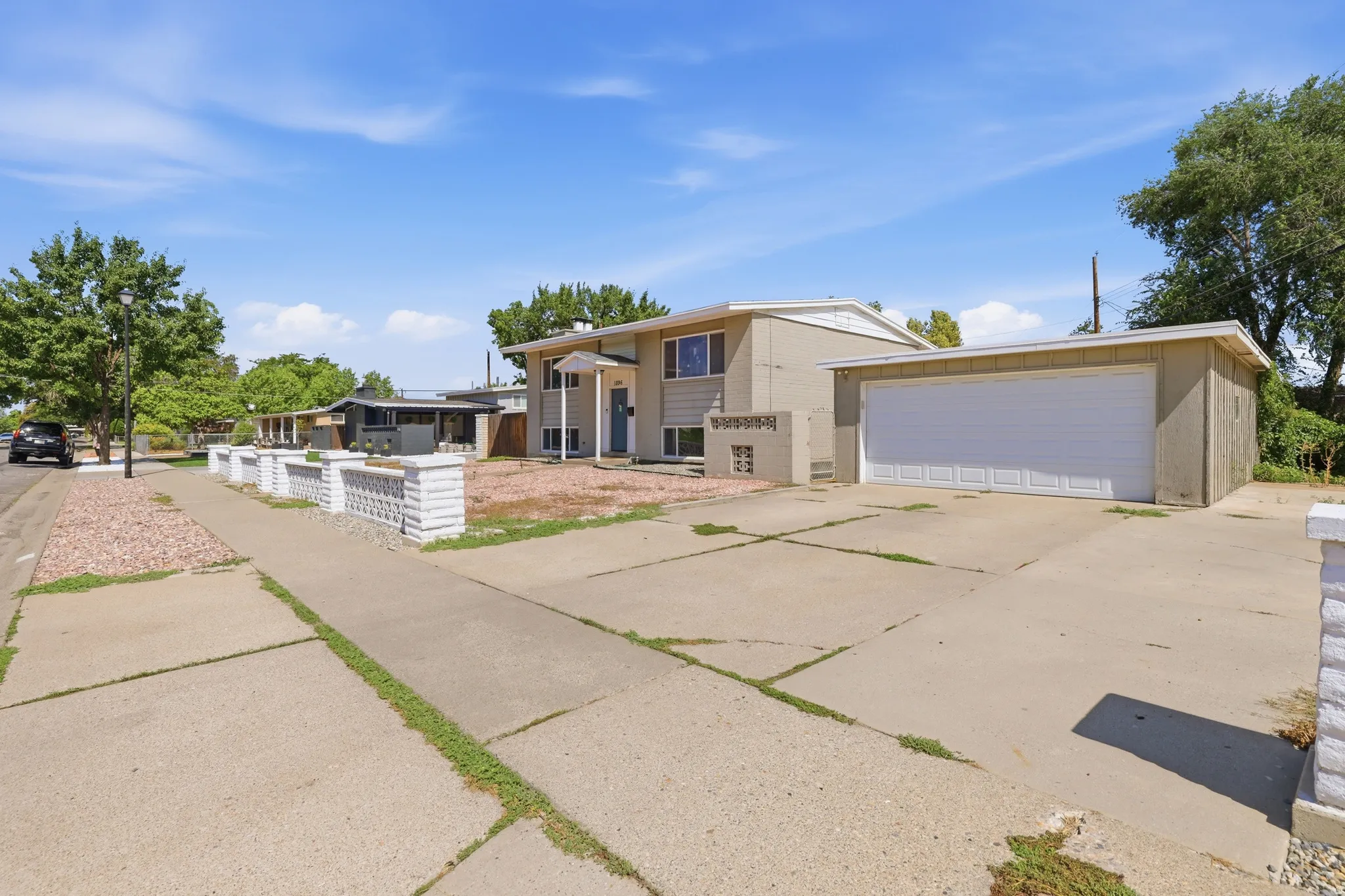 Two-story exterior with a covered entry and attached garage